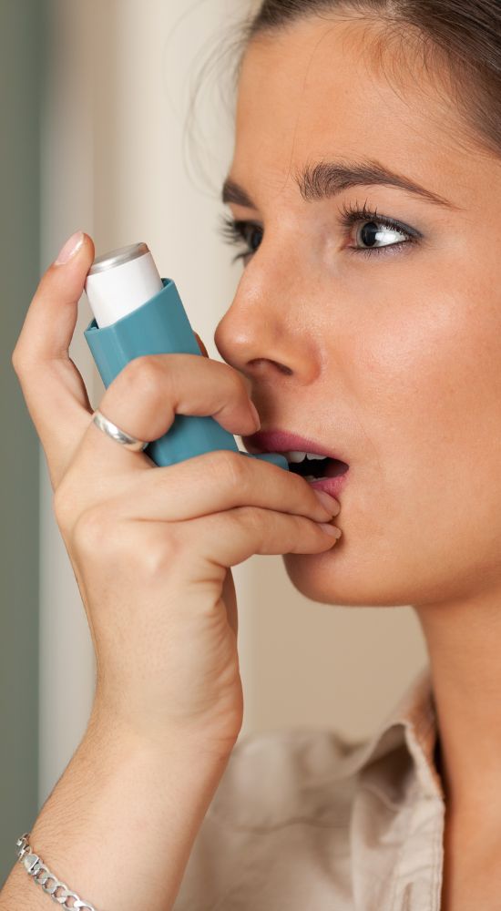 Patient using inhaler